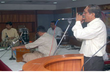 employee plays the mouth organ employee plays the mouth organ